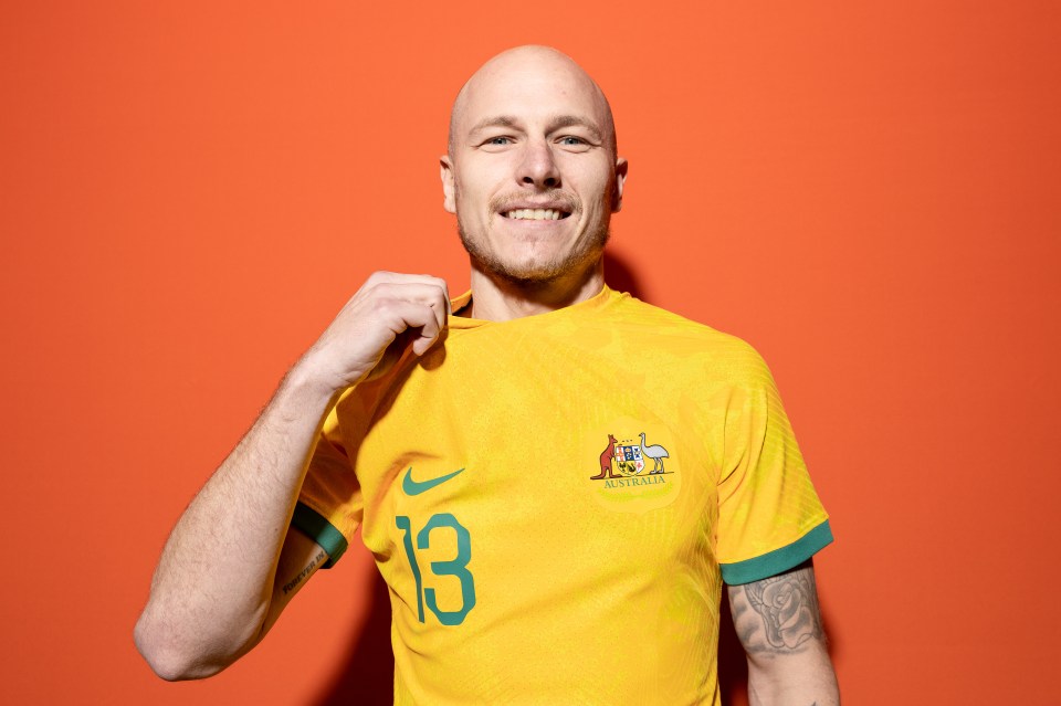 Aaron Mooy shows off the official Australia World Cup kit