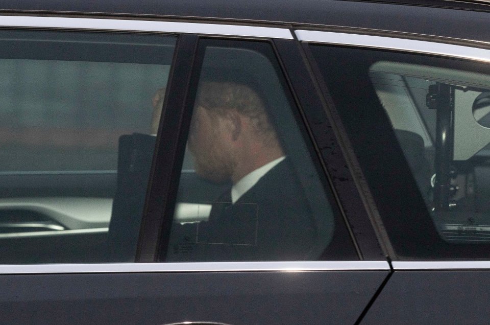 He travelled to Balmoral by car, wearing a dark suit and tie