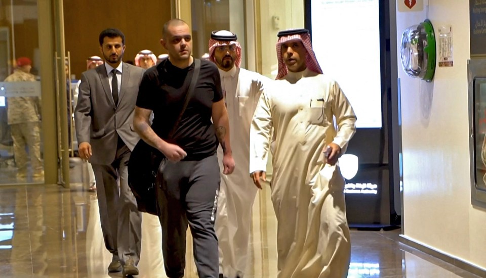 Rleased British prisoner Aidan (second right) arriving in the capital Riyadh