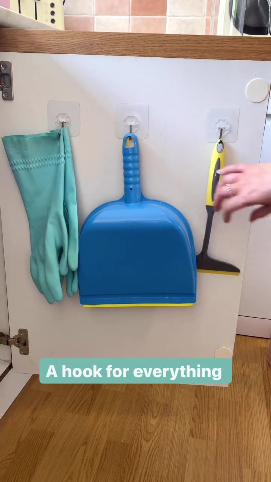 She also added hooks to the doors and the wall space to hang the dustpan and some rubber gloves