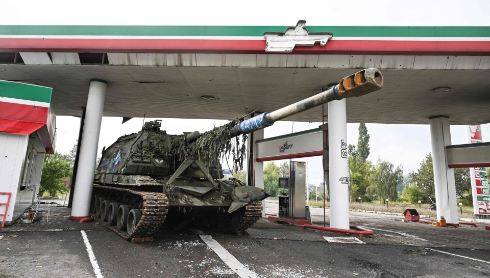 A Russian tank abandoned in a Ukrainian petrol station