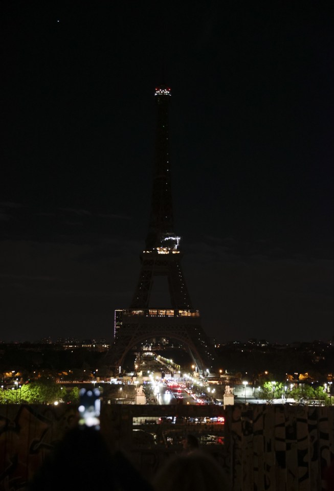 The Eiffel Tower in Paris has turned its lights off as a mark of respect