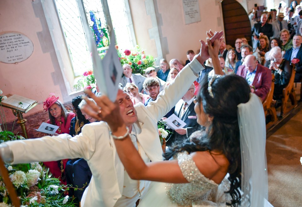 The couple celebrate at the church ceremony