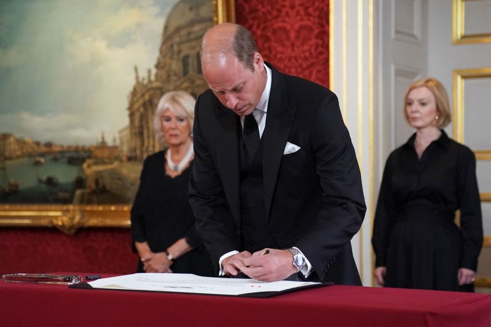 William's awkward left-handedness was there for all to see when he signed the proclamation document