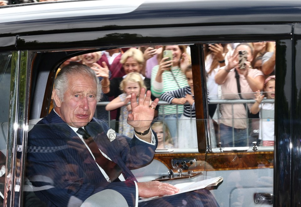 Britain’s King Charles arrives at Buckingham Palace as he waves to crowds