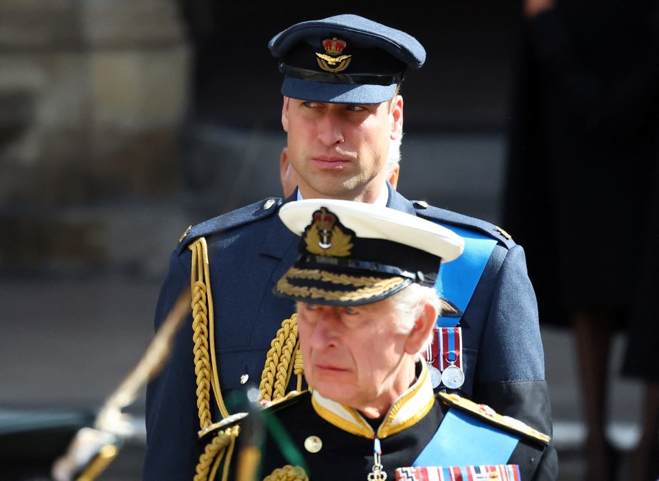 Prince William and the King preparing to enter the church for the Queen's funeral