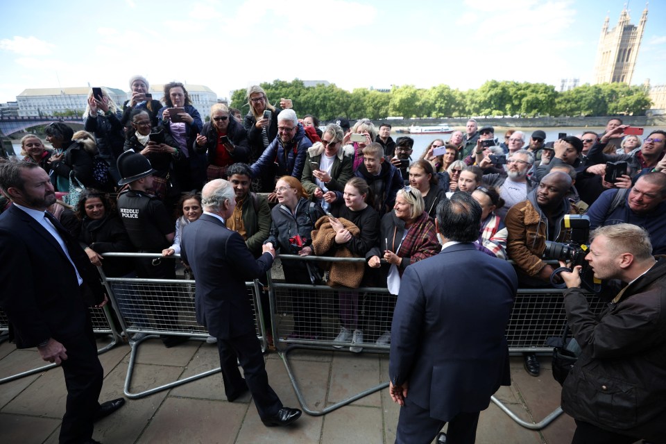 The King greeting people queueing to pay their respects to his mother in London