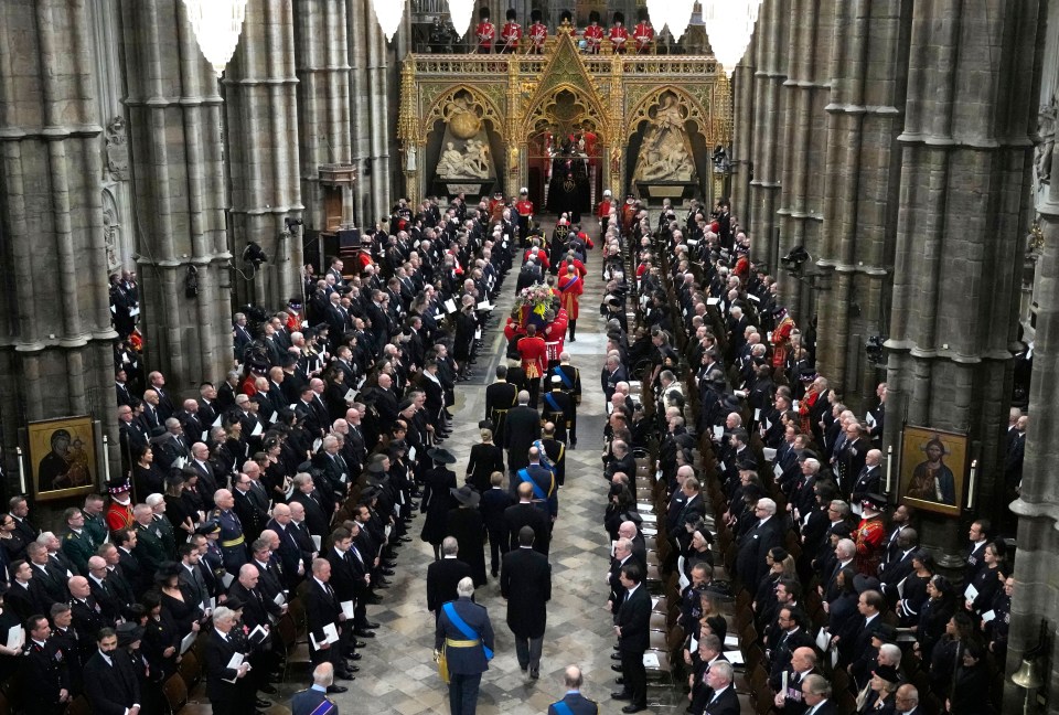 They could be seen walking behind the Queen's coffin as it was carried into the abbey