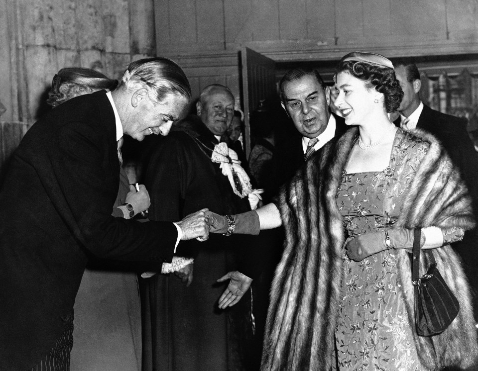 Anthony Eden smiles and bows as he welcomes Queen Elizabeth II on her arrival at London’s Guildhall on May 15, 1956