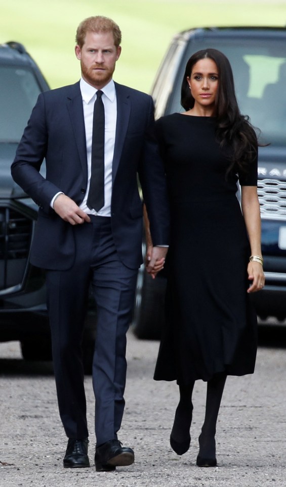 Harry held his wife’s hand as they walked through Windsor