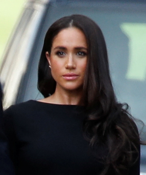 Meghan looked deep in thought as they walked around Windsor