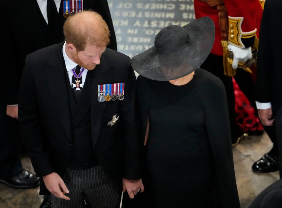 Meghan and Harry appeared to hold hands after the Queen's funeral service