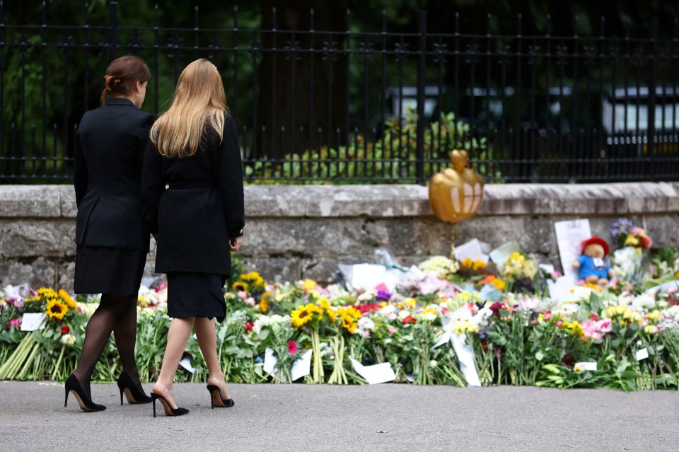 Princess Beatrice and Princess Eugenie view tributes for the Queen outside Balmoral Castle