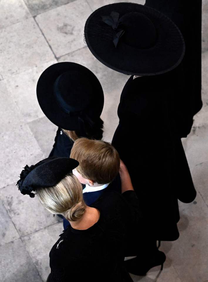 Sophie, Countess of Wessex, puts a comforting arm around Prince George