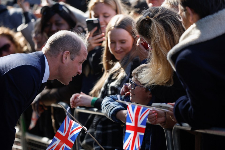 Wills chats to a young boy in the long queue