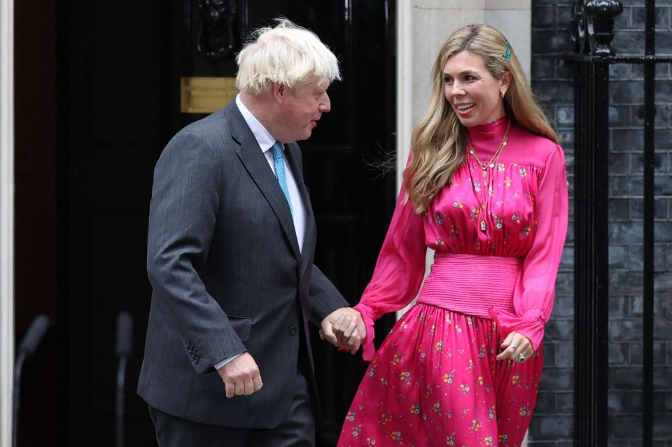 Doting Carrie Johnson held Boris Johnson's hand ahead of his final speech as PM