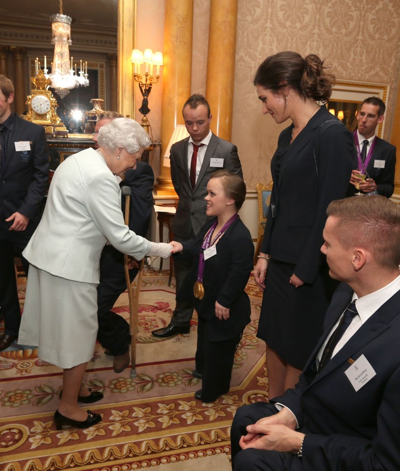 The five-times Paralympian champ, here with the late Queen, is the show’s first contestant with dwarfism