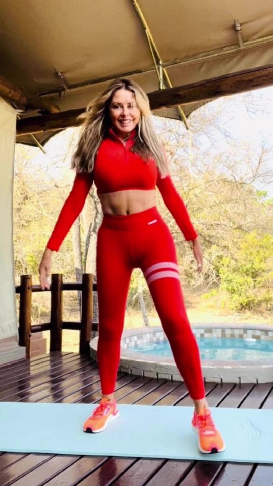 Carol Vorderman looked incredible in her red gym set during workout and insisted that she gives her 'middle finger' to trolls