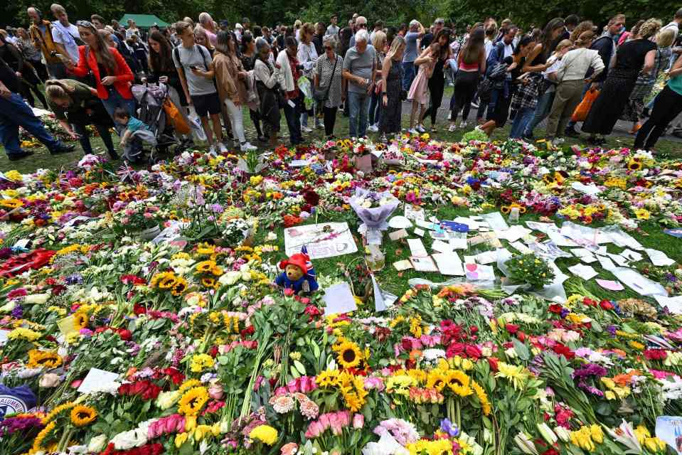 Seas of flowers framed Royal residences yesterday as thousands turned out to honour the Queen