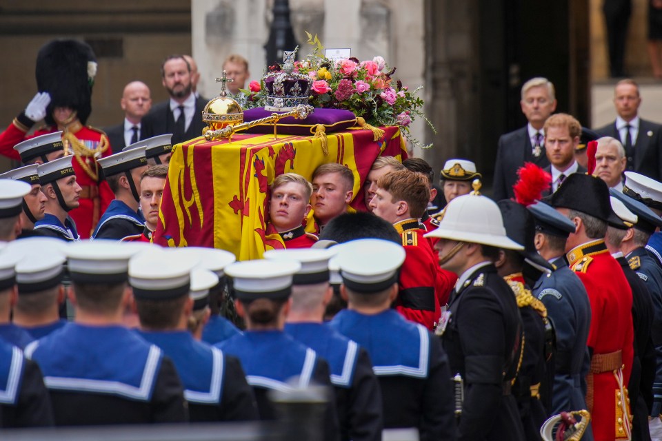 The coffin of Queen Elizabeth II is placed on a gun carriage