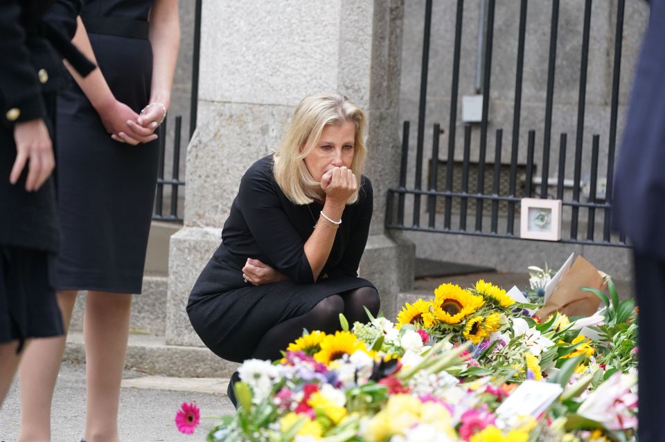 She became tearful as she looked at flowers for the Queen in Balmoral on Saturday