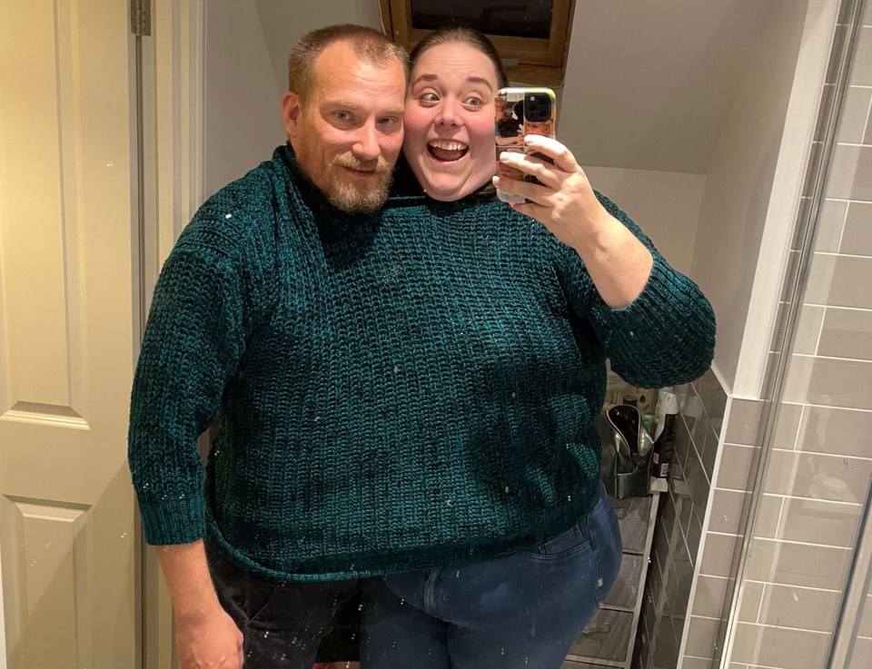 Lindsey with husband Terry - who are both able to fit in one of her old jumpers