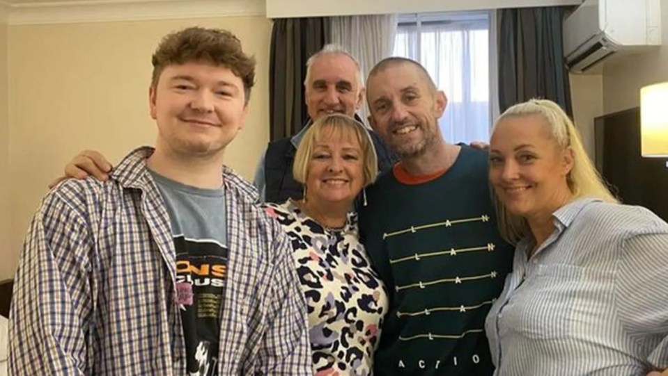 Shaun Pinner, in the dark top in the centre, has been reunited with his family