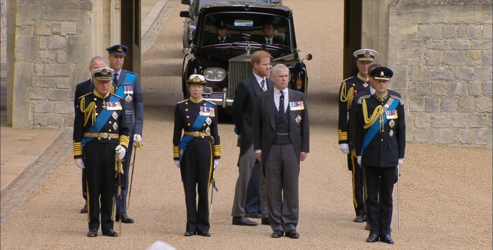 The King standing with his grieving relatives as the Queen's coffin arrived at Windsor Castle