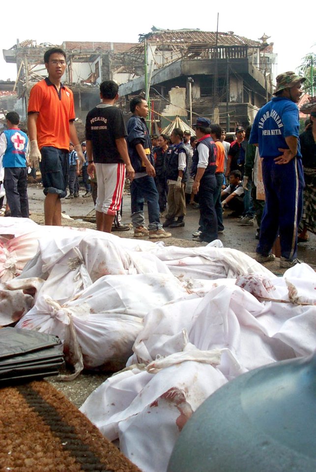 Bodies are covered in sheets at the scene of the attack