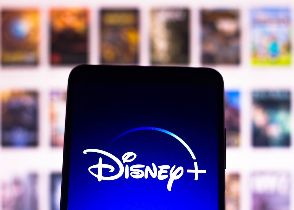 a phone with the disney plus logo on the screen