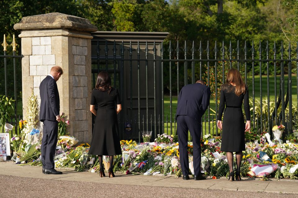 The royal couples looked at the flowers and notes left by well-wishers