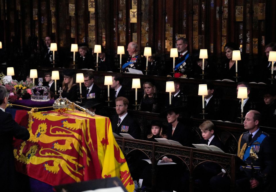 The Duke of Sussex, Princess Charlotte, the Princess of Wales, Prince George, and the Prince of Wales, watch as the Imperial State Crown and the Sovereign’s orb and sceptre are removed from the Queen's coffin