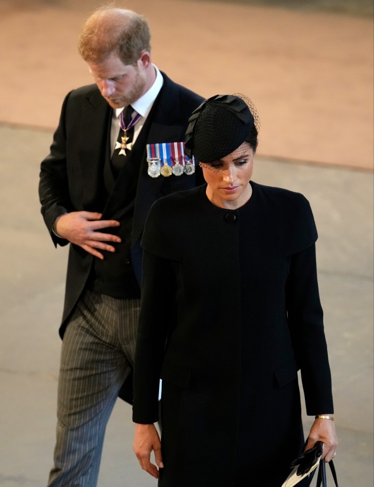 He was supported by wife Meghan, who joined the other wives of Windsor in black