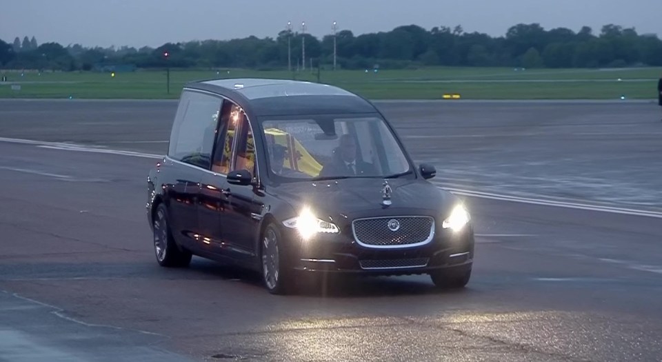 The hearse leaving Northolt Airport