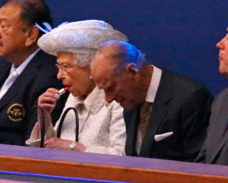 The Queen applying her lipstick during the Opening Ceremony for the Glasgow 2014 Commonwealth Games