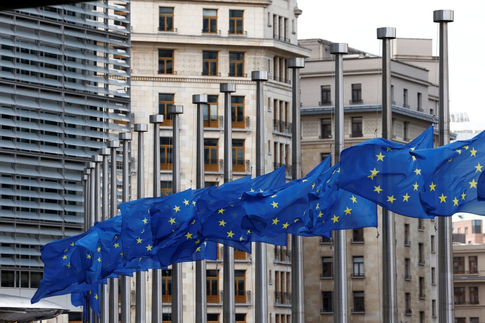 EU flags fly at half mast outside the European Commission headquarters in Brussels, Belgium