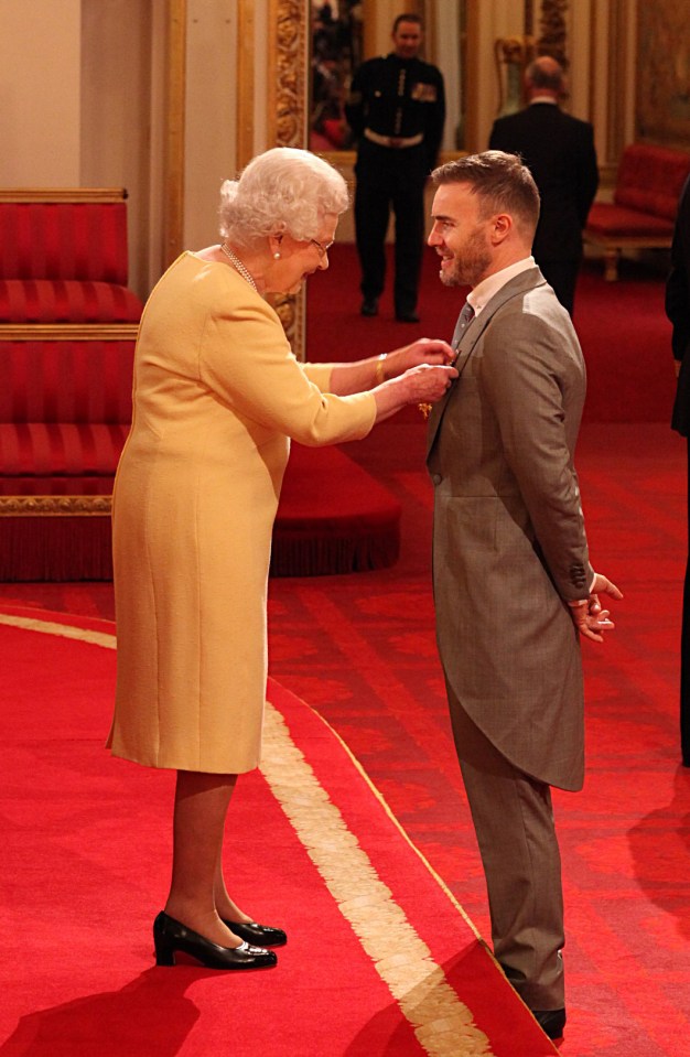 Her Majesty was a fan of the singer - pictured Gary receiving his OBE