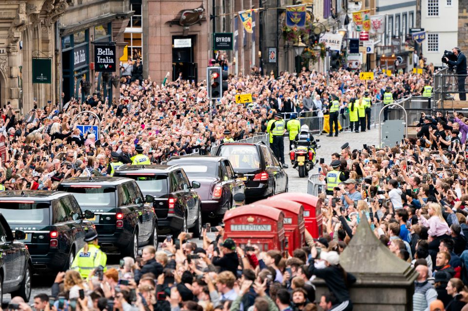 Crowds line the streets in Edinburgh as the Queen’s coffin arrives yesterday