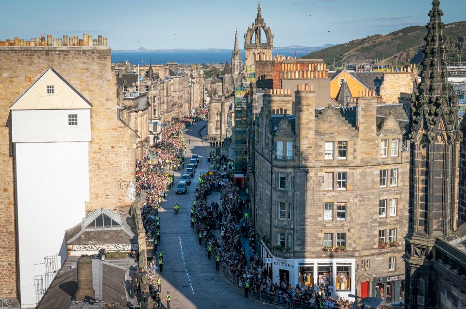 The hearse is pictured travelling up the Royal Mile