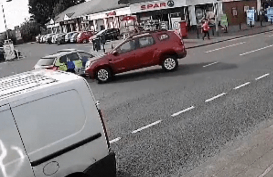 A police car swerved out of the way of another vehicle