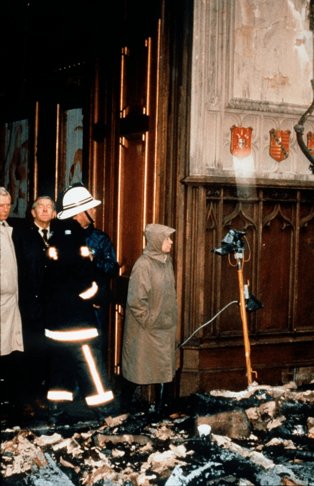 The Queen inspects damage caused by a fire at Windsor Castle in 1992