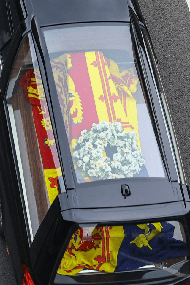 The oak coffin was draped in the Royal Standard of Scotland