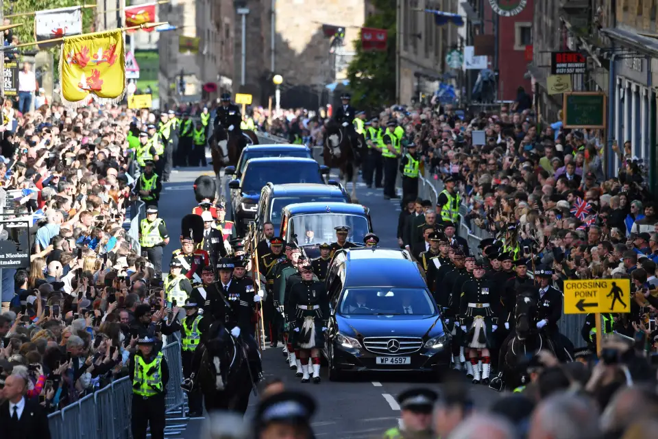 The crowds remained silent as the coffin was driven through the city