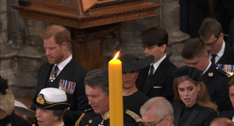 The couple sat in the second row for the ceremony