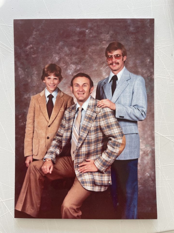 A family photo of Dahmer with his father and younger brother