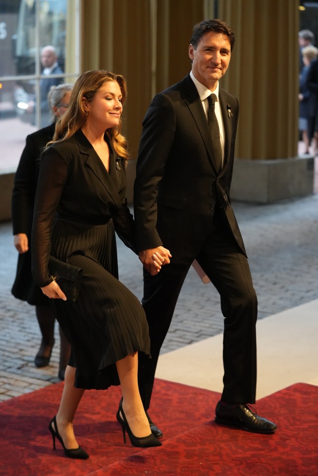 Canadian Prime Minister Justin Trudeau smiled briefly at journalists as he arrived