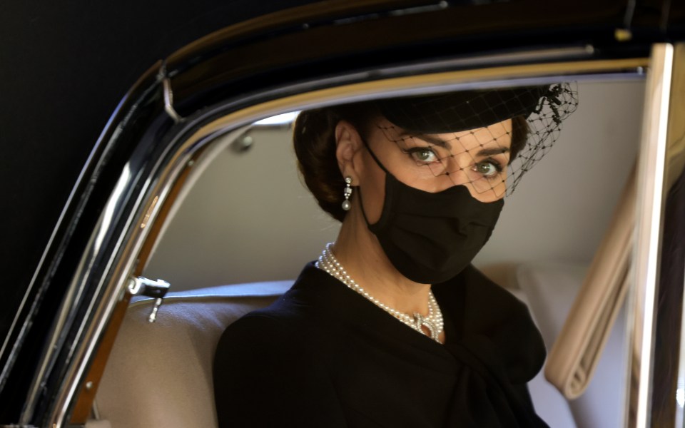 The photo drew comparisons to this shot which shows Kate looking out from a car window as she arrived for the funeral of Prince Phillip in Windsor on Saturday, April 17, 2021