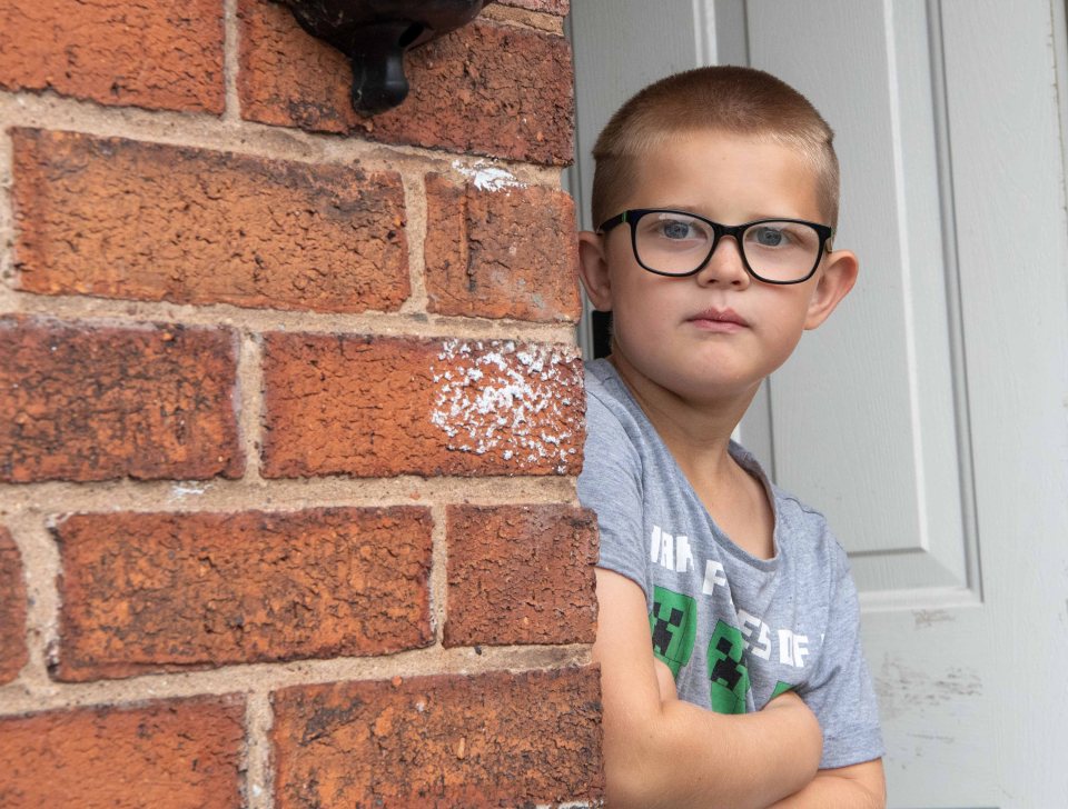 The youngster is unable to write his own name properly, his mum says