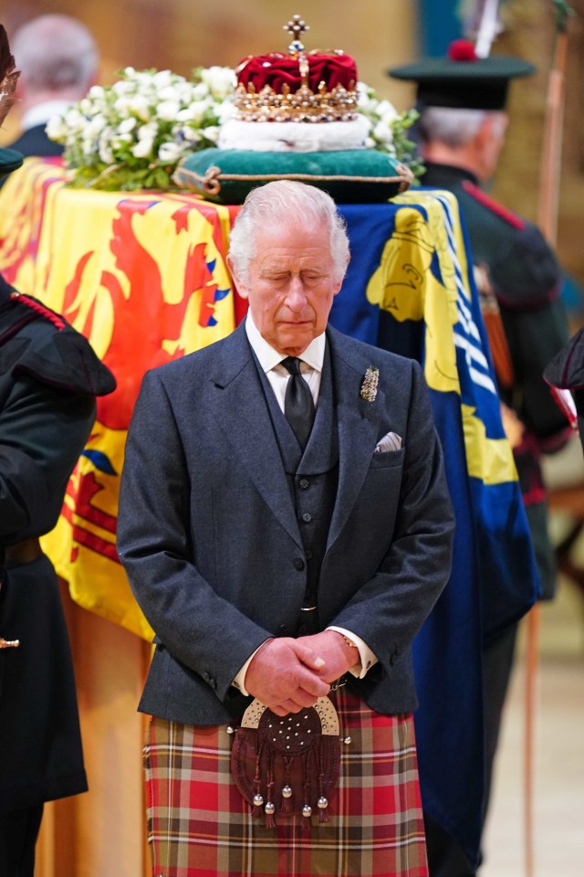 King Charles looked solemnly at the ground as he stood by the Queen's casket