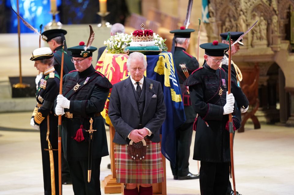 His Majesty bowed his head with siblings Princess Anne and Princes Edward and Andrew